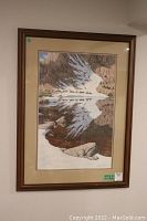Full view of framed Bev Doolittle print showing mountain and lake scene with riders and reflection forming bird shape.