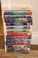 Stack of vintage Disney VHS movies sealed in original plastic wrap, most titles from the Black Diamond collection.