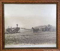 Framed black and white photo titled 'Threshing Time at Port Guichon' showing a field with a threshing machine and horses.