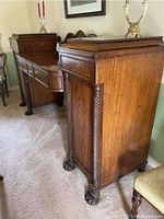 Angled front-right view showing twist column detail and carved claw foot