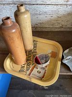 Teachers whiskey metal serving tray with two ceramic gas canisters in tan and brown, and a small metal canister.