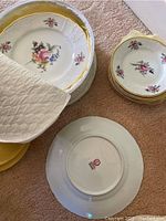 Photo showing dinner plates, side plates, and one plate with backstamp indicating Sonata made in Czechoslovakia