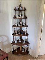 Overall view of six-tier walnut whatnot cabinet in corner