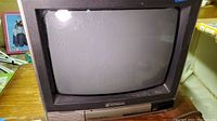 Front view of the vintage Hitachi TV showing the CRT screen and Hitachi logo.