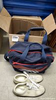 Blue and red bowling bag and white bowling shoes with 12 inch soles