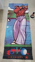 Full view of golf flag showing golfer illustration and Air Canada branding.
