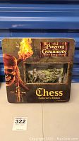 Front view of the closed box of the Pirates of the Caribbean Dead Man's Chest Chess Collector's Edition showing pirate skull artwork and chess labeling.