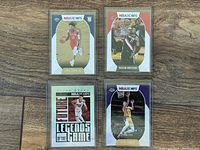 Four Panini NBA Hoops basketball cards from 2021 shown front side: Tyler Herro, Alex Caruso, Hassan Whiteside, Kira Lewis Jr.