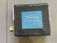 Photo showing the Bella Russo duvet cover set in original sealed packaging with label visible stating content.