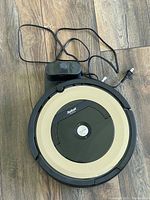 Top view of Roomba 895 with charging base and power cord