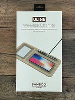 Front of the product box showing the product design, brand ULINE, and bamboo material with compartments for phone, pen, and small items.