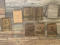 Laser cut wooden and acrylic sports card dividers showing years 2021, 1989, 1958, 1970 and 1980 etched on them with crossed hockey sticks design.