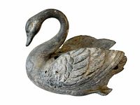 Top and side view of antique swan-shaped flower frog with detailed feathers and bird features.