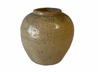 Front view of small antique stoneware vase showing smooth, glazed surface with light brown color and slight speckling.