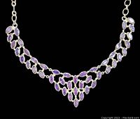 Full front view of collar-style necklace with marquise amethyst stones set in silver.