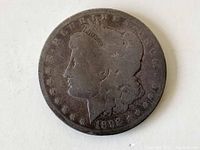Obverse side of 1892 Morgan silver dollar with Lady Liberty profile and date 1892
