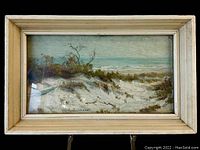 Front view of framed oil painting depicting beach dunes and ocean