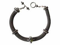 Full view of the sterling silver chainmail style bracelet showing peridot centerpiece and pearl detail on clasp.