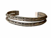 Sterling Native American double band cuff bracelet showing geometric stamped designs.