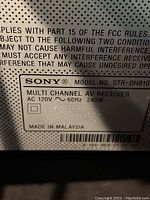 Close-up of model and power details on AV Receiver Sony STR-DH810.