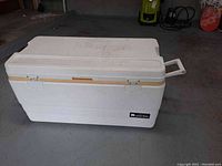 Full side view of white Igloo 94 Marine cooler showing hinged lid and handle