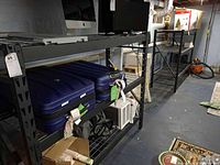 Front view showing two shelving units side by side loaded with items
