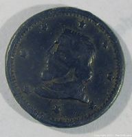 Obverse side showing profile of Columbus with date 1492-1892 and stars around edge