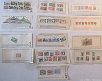 Multiple approval cards with vintage used stamps in various designs and colors, showing global coverage and pre-1935 issues.