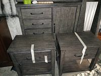 Three-piece set with tall dresser at back and two end tables in front