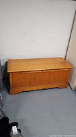Full view of wooden Lane storage chest showing closed top and front panel