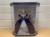 Frontal photo of boxed Millennium Princess Barbie Doll in display packaging, showing doll and accessory clearly.