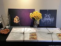 Photo showing two art prints, glass vase with yellow artificial flowers, small ceramic fall leaf dish, small glass measuring cup, and two large glass platters in packaging.