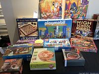 Full view of all board games, puzzles, and Playmobil sets.