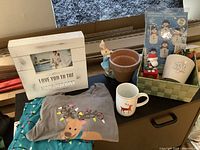 Image showing all items from above including picture frame, bunny pot, pajamas, coffee cup, snowflake vase, and Christmas coffee cup lights