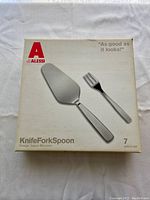 Box exterior showing Alessi branding, set name and designer, with two cutlery items pictured.