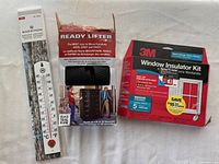 Photo of Easy Lift Ready Lifter, 3M Window Insulator Kit, and Marathon thermometer in packaging or as displays.