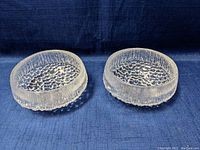 Top view of two clear textured glass bowls with ice-like pattern from Iittala Ultima Thule series