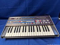 Angled front view of Solton Programmer 24s showing 32-key keyboard and control panel