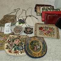 Overview of all purses and wallets displayed on carpet
