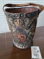 Front view showing central crowned shield and overall shape