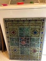 Full front view of stained glass panel showing overall design and colors