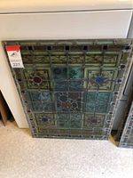 Full view of panel leaning against appliance