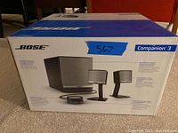 Box showing product image and Bose Companion 3 branding with blue tape marked '567'
