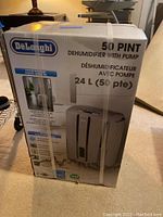 Full view of the sealed box showing branding, product image, and features.