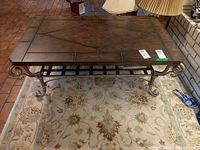 Top angled view showing length and overall shape, also visible area rug underneath and some decor items nearby