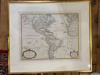 Front view of framed antique map showing the engraved image, decorative cartouches, and gold-tone frame