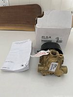 Image showing the thermostatic valve, instruction manual, and original Kohler box with label 2975-KS-NA.