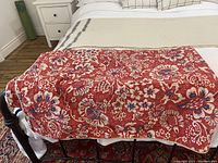 Full view of Ralph Lauren Villa Martine single duvet cover with red and blue floral and paisley pattern on fabric