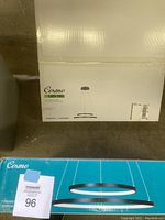 Box front showing 'Cosmo LED Del' pendant light with matte black finish and product illustration.