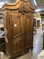 Full front view of the carved double door cabinet
